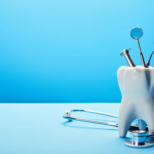 close-up-view-of-white-tooth-model-stethoscope-an-2026-03-12-22-47-11-utc