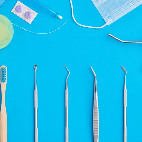 dentist-tools-over-blue-background-top-view-2026-03-09-22-25-42-utc(1)